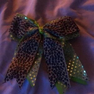 A Green polkadot, bow with cheetah print ribbon